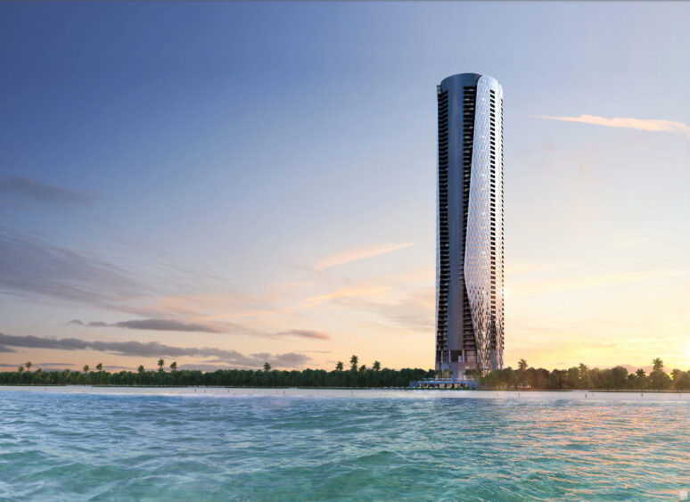 A tall, modern skyscraper, built by the shoreline and surrounded by palm trees, stands elegantly above the calm blue water with a pastel-colored sunset sky in the background—a scene as luxurious as a Bentley. Lifestyle